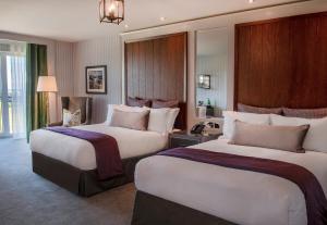 a hotel room with two beds in a room at Old Course Hotel St Andrews in St. Andrews