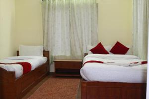 Postel nebo postele na pokoji v ubytování Hotel Snow Leopard