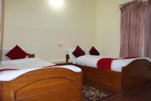 Postel nebo postele na pokoji v ubytování Hotel Snow Leopard