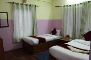 Postel nebo postele na pokoji v ubytování Hotel Snow Leopard