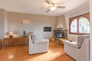 A television and/or entertainment centre at Casa Ancora by MarCalma