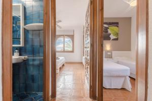 A bed or beds in a room at Casa Ancora by MarCalma