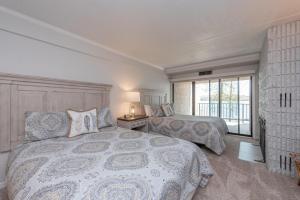 a bedroom with two beds and a window at 207B One Bedroom One Bath in Oakland +17 photos