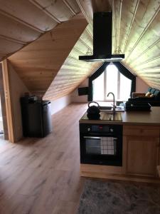Kuchyňa alebo kuchynka v ubytovaní Apartamenty Perła Orawy