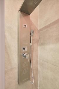 a shower with a shower head in a bathroom at Oasi dei Geni in Foggia