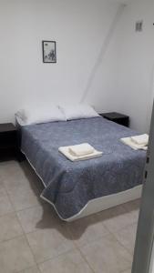 Voodi või voodid majutusasutuse MyR alojamiento toas