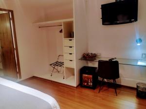 A television and/or entertainment centre at Hotel CLARUM 101