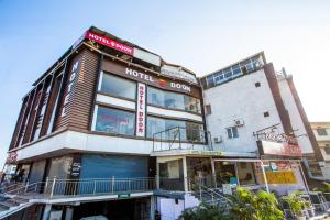 a building with a hotel on top of it at HOTEL DOON in Dehradun