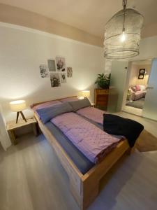 a bedroom with a large bed in a room at Ferienwohnung am Ruwer-Hochwald-Radweg in Gutweiler