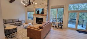 a living room with a couch and a fireplace at Fernie Escape - Mountain Home on the Ski Hill in Fernie