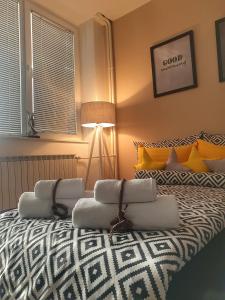 a bedroom with a bed with a couch on it at NOA Luxury Apartment in Bitola
