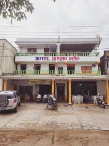 a hotel with a car parked in front of it at Divino Niño Hotel in Leticia