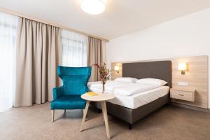 En eller flere senge i et værelse på Gesundheits- & Wellnessresort Salzerbad