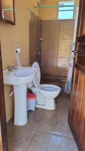 a bathroom with a sink and a toilet at Mirador del Diablo in Punta Del Diablo