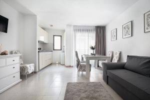 a living room with a couch and a table at Hola Mar in Torrevieja