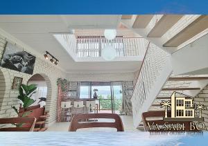 a view of a room with chairs and a staircase at Va sabi bo, luxury family living in Hartbeespoort Dam in Hartbeespoort
