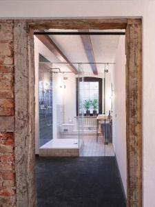 a bathroom with a glass shower in a room at Gasthof Strietholt in Everswinkel