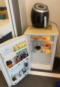 an open refrigerator with a pot on top of it at Ange's BnB - Self Contained Unit with Ensuite in Lyndhurst