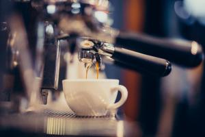 a coffee maker is making a cup of coffee at Pescara Blu B&B in Pescara