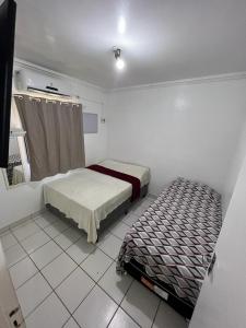 En eller flere senge i et værelse på Hospedagem em Porto de Galinhas - Pertinho do Mar