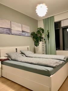 Postel nebo postele na pokoji v ubytování Fabulous Morden Apartment in Helsinki