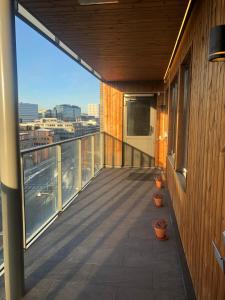 a balcony of a building with a view of a city at Solna Property Apartment in Stockholm