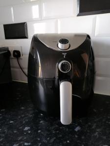 a black and white toaster sitting on a counter at Chantilly in Ickenham