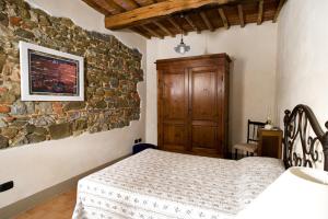 Postel nebo postele na pokoji v ubytování Agriturismo Podere Luisa