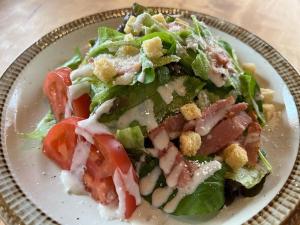 a plate with a salad with tomatoes and cheese at irodori in Matsumoto