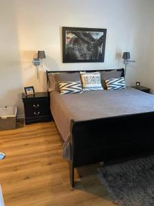 a bedroom with a bed with pillows on it at Two bedroom Sea Trail condo in Sunset Beach in Sunset Beach