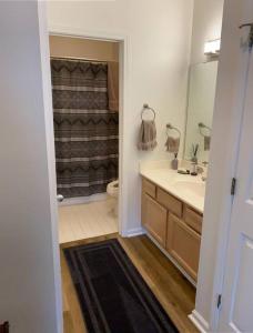 a bathroom with a sink and a toilet and a shower at Two bedroom Sea Trail condo in Sunset Beach in Sunset Beach