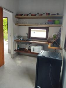 Kuchyň nebo kuchyňský kout v ubytování Casas Delu Caraiva