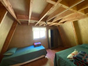 Voodi või voodid majutusasutuse Araucaria Lodge toas