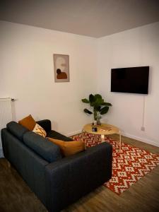 Televízia a/alebo spoločenská miestnosť v ubytovaní Nature&Spa Appartement avec Jacuzzi & Sauna privé