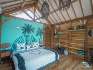 a bedroom with a large bed in a room at Rumah Tara Modern 3 bedroom pool and garden villa in Gili Air in Gili Islands