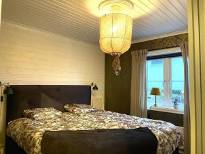 Postel nebo postele na pokoji v ubytování Holiday home LJUNGSKILE VIII