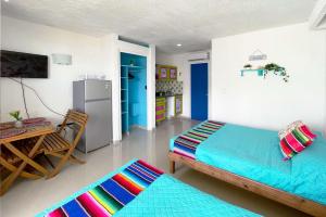 Postel nebo postele na pokoji v ubytování Renovated Studio in Cancun Beach at the Hotel Zone