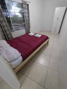 Кровать или кровати в номере Departamento La Sureña