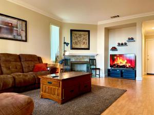 a living room with a couch and a fireplace at Homeinn - Luxe Residence Near Victoria Mall & Mills in Rancho Cucamonga