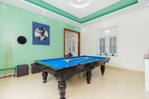 a pool table in a room with a ceiling at Villa Vũng Tàu - An Thảo Home's in Vung Tau