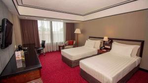 Voodi või voodid majutusasutuse Redtop Hotel & Convention Center toas