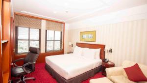 Voodi või voodid majutusasutuse Redtop Hotel & Convention Center toas