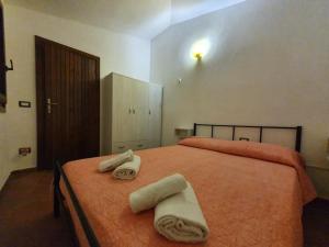 Postel nebo postele na pokoji v ubytování Villa Capodorso, Palau Porto Pollo