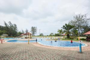 a group of people in a pool at a park at Terengganu Equestrian Resort in Kuala Terengganu