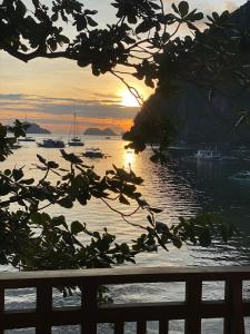 a view of the ocean with boats in the water at Sophias Beach Guest House in El Nido