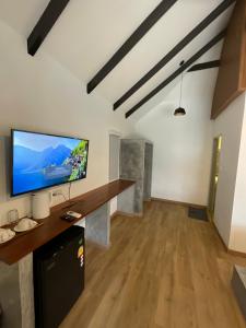 a large living room with a flat screen tv at Island Spa Resort in Ko Tao