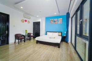 Postel nebo postele na pokoji v ubytování La Maison Danang Beach Hotel