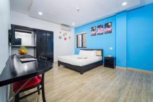Postel nebo postele na pokoji v ubytování La Maison Danang Beach Hotel