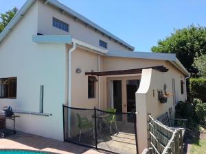 a view of a house with a patio at Dorset Cottage in Cape Town