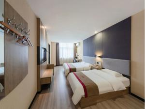 מיטה או מיטות בחדר ב-Thank Inn Plus Hotel Hebei Shijiazhuang Yuhua District of Hebei Normal University